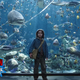 Lil’ Arthur Curry is us, the marine life is Comic-Con news, and the fractured tank glass is our fragile grasp on sanity.